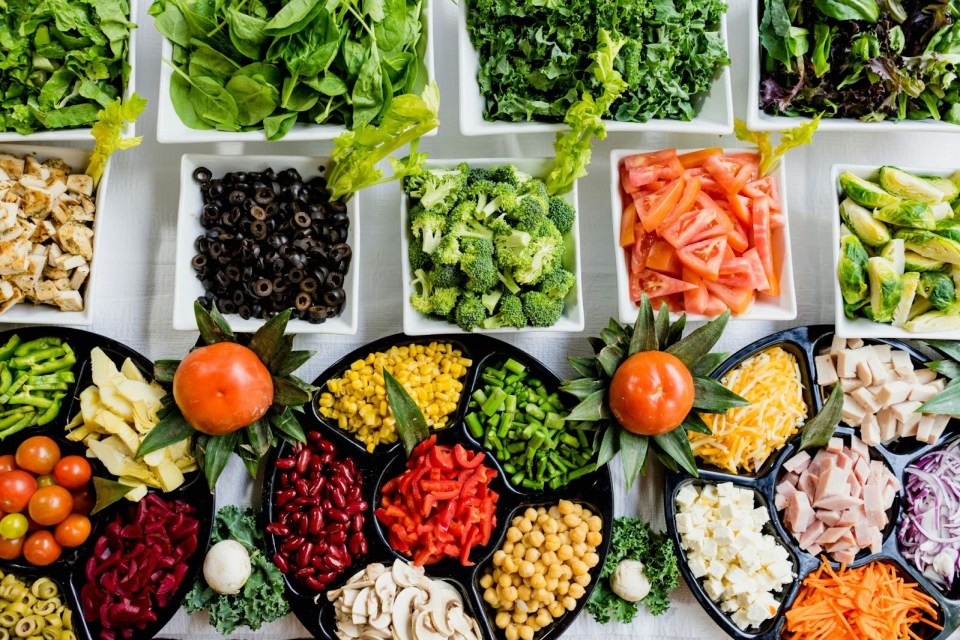 Raising healthy kids: how nutrition affects child development for lifelong well-being A vegetable bar with a variety of vegetables for an article on raising healthy kids: how nutrition affects child development for lifelong well-being