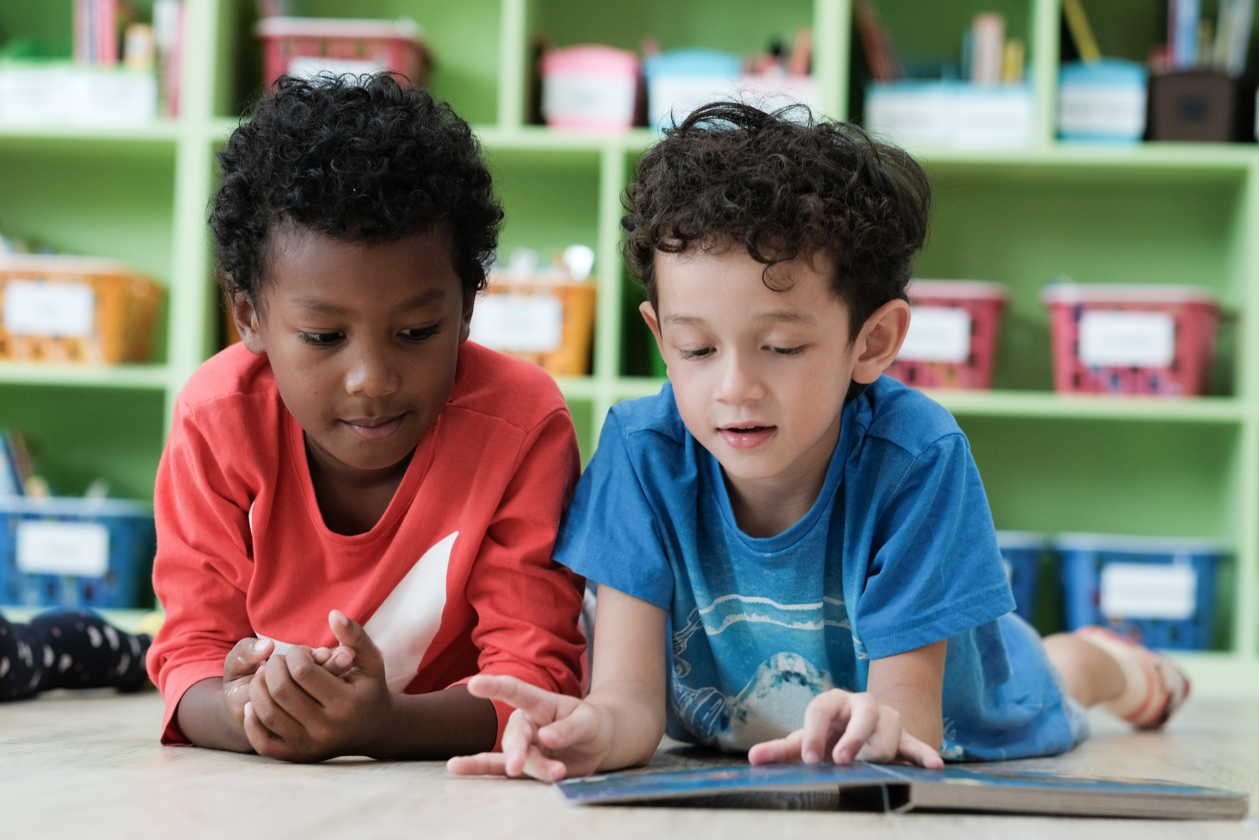 Should children learn about racism: why it matters Two boys, african american and white in school for an article about teaching children about racism