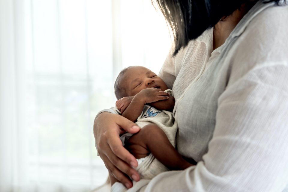 Postpartum and black motherhood Adobestock 415875595 scaled on successful black parenting magazine
