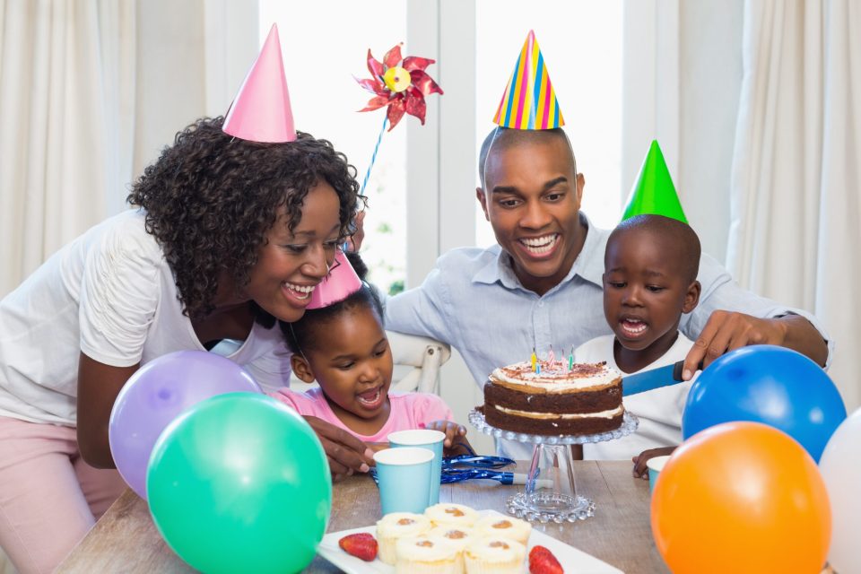 How to really rock a themed birthday party African american parents having a themed birthday party for their children.