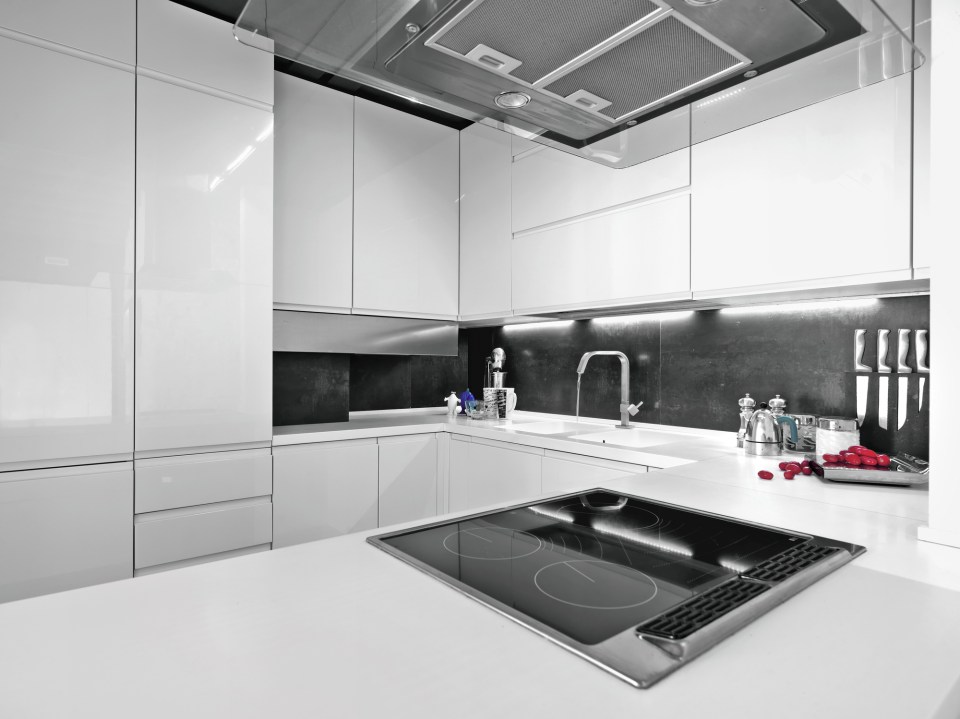 What makes a durable kitchen cabinet? Key factors to consider Modern white kitchen with durable high-gloss cabinets and sleek finishes. What makes a durable kitchen cabinet? Key factors to consider.