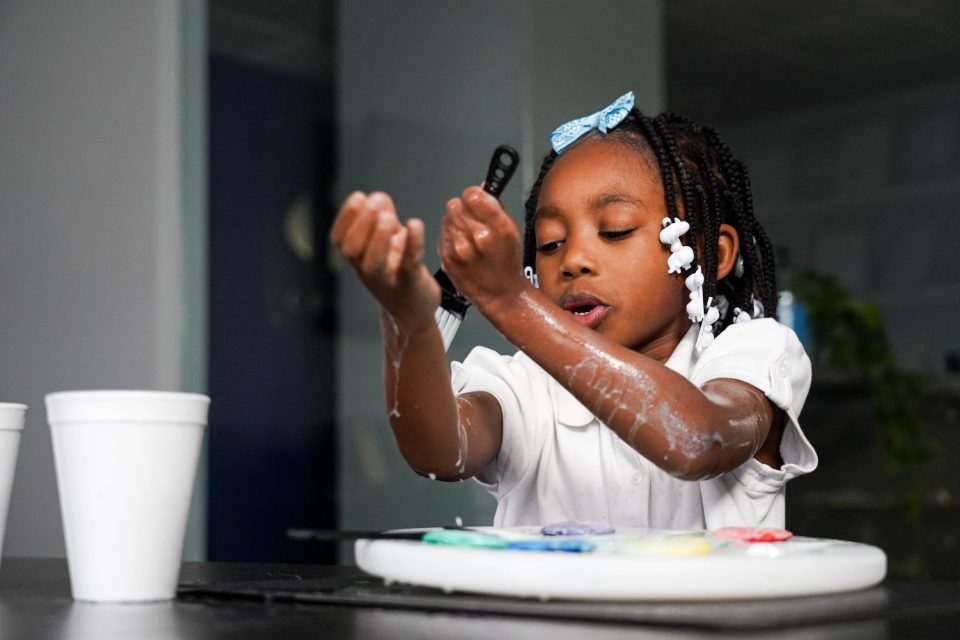 Transform your child's bathtime battles into good clean fun An african american girl paints her arms with paint yourself clean soaps used for bathtime.