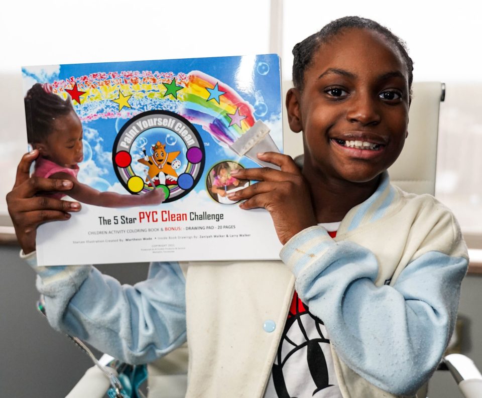 Transform your child's bathtime battles into good clean fun An african american girl holds up paint yourself clean paint set used for bathtime.