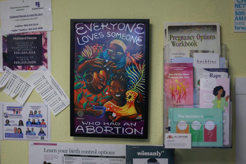 Confusion over how pregnancy dates are measured is widespread – and makes for uninformed debate over abortion limits A colorful poster says 'everyone loves someone who has has an abortion,' and is surrounded by other papers on a wall.