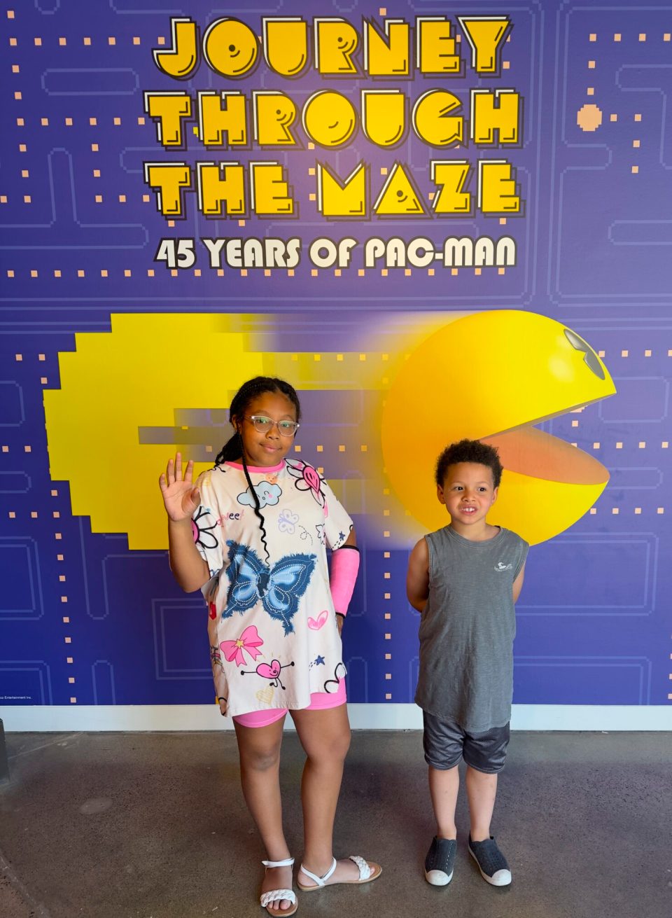 Irvine, california: a family-friendly option with plenty to experience and a few lessons learned The pac-man exhibit in irvine, california, with a young black girl with braids and a young boy.