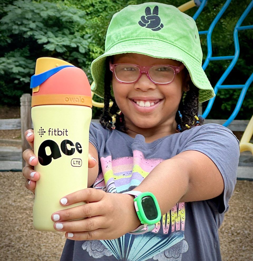 Back-to-school: why smart tech is a lifeline for black parents Smiling black girl showing fitbit ace lte smartwatch for back-to-school tech safety - back-to-school:  why smart tech is a lifeline for black parents