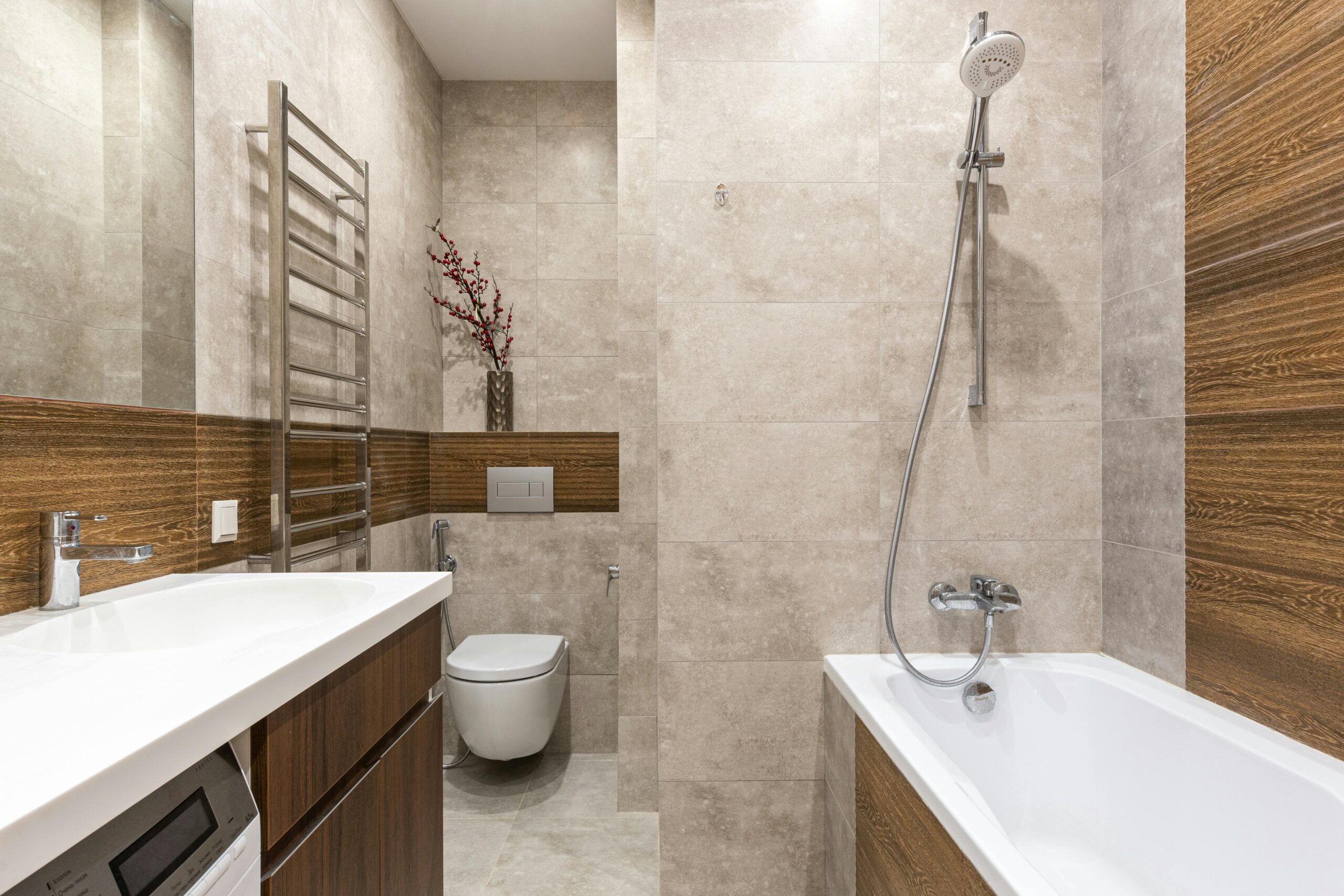 Small bathroom or kitchen? Space-saving styling tips that work Small bathroom space-saving styling tips with modern wall-mounted fixtures, reflective surfaces, and compact vanity design for an article titled, "small bathroom or kitchen? Space-saving styling tips that work"