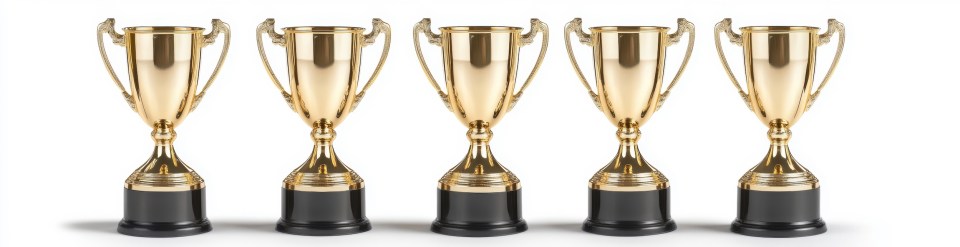 Gold trophies lined up for award celebration, successful black parenting podcast and magazine award recognition, backtalk podcast award wins