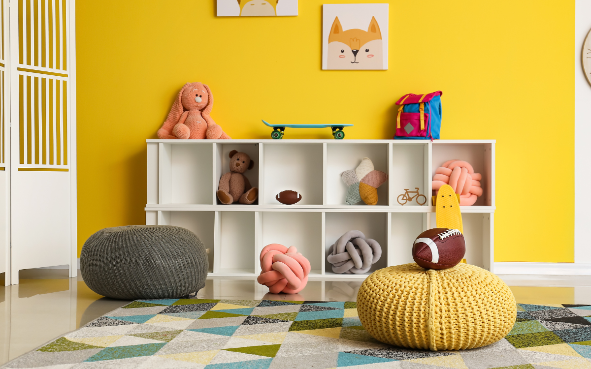 Personalized art for kids' rooms : boost creativity and create a unique space for your child A kids room with a shelf and yellow wall with artwork for an article about personalized art for kids' rooms : boost creativity and create a unique space for your child