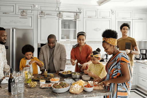 Empowering healthy food choices for kids in african american communities African american family over a typical soul food meal while empowering healthy food choices for kids.